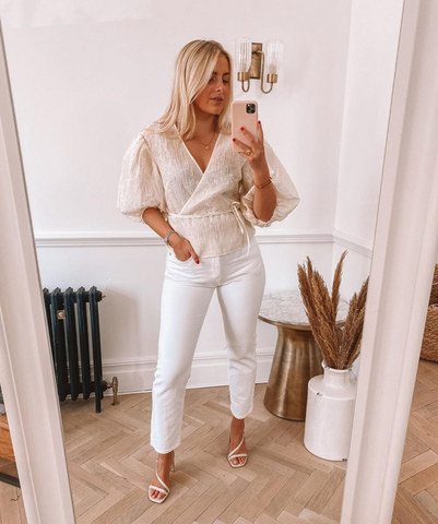 all-white trouser outfit worn by blogger